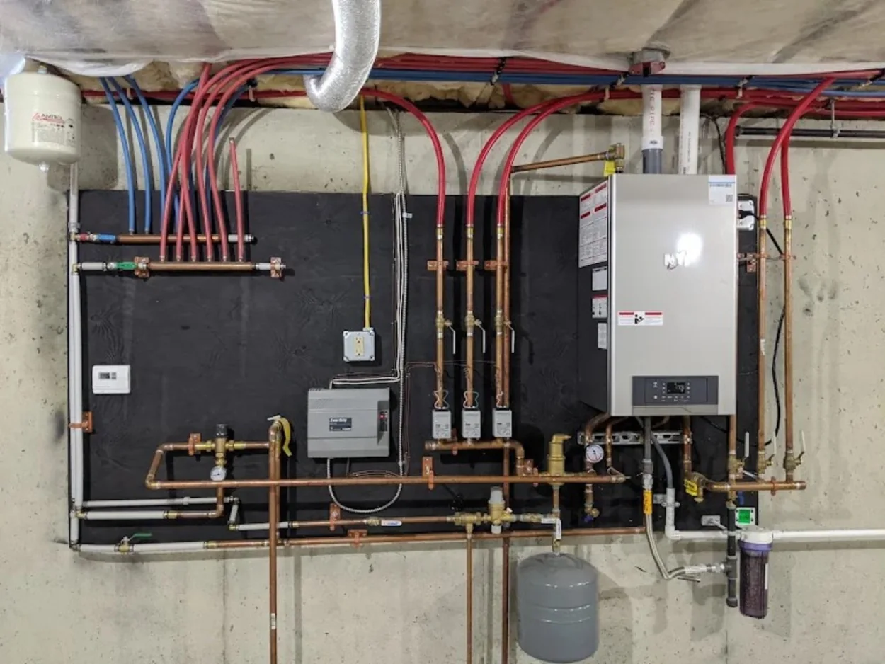 Complete boiler installation with pumps and copper pipework