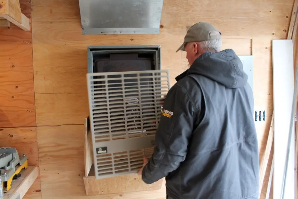 Work beside a wall-mounted furnace